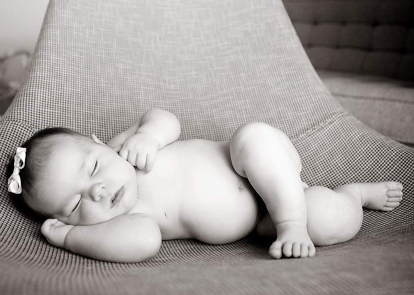 High angle view of naked newborn baby boy.